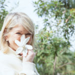 Martha Stewart holds a tropical gardenia at Naples Botanical Garden