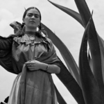 Frida Kahlo standing next to an agave plant, by Toni Frissel
